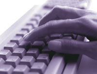 Fingers pressing keys